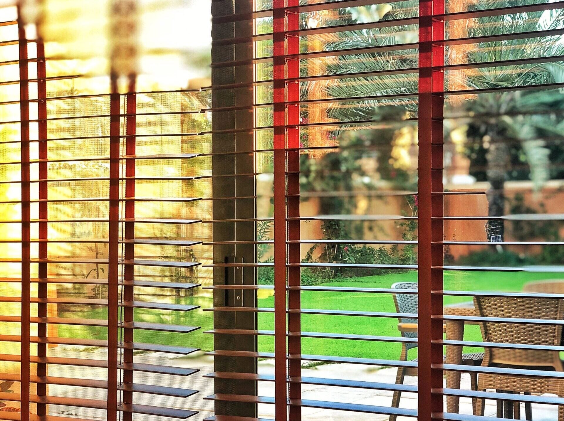 Morning Sunlight On Wooden Blinds | Dragon Shutters and Shades